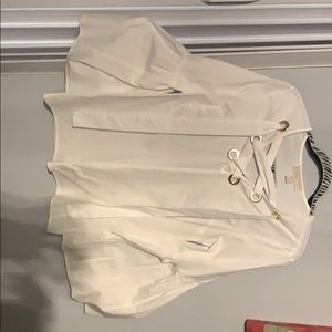 White top with gold accents and flows sleeves